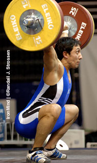 2000 Olympic silver medalist Georgi Markov (Bulgaria) sticks his 155-kg opening snatch at the 2005 World Weightlifting Championships (Doha, Qatar). IronMind® | Randall J. Strossen, Ph.D. photo.