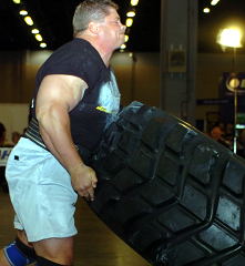 Mark Philippi on the tire flip at the 2004 US Strongman Nationals (MHP Pro Strongman Invitational) in Atlanta, Georgia. IronMind® | Randall J. Strossen, Ph.D. photo. Mark Philippi on the tire flip at the 2004 US Strongman Nationals (MHP Pro Strongman Invitational) in Atlanta, Georgia. IronMind® | Randall J. Strossen, Ph.D. photo.