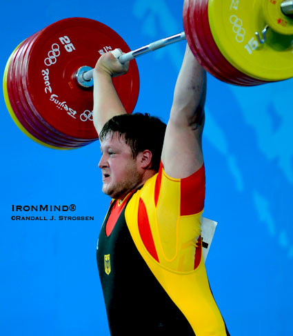 He had just rammed this third attempt 258-kg clean and jerk overhead - Matthias Steiner was mere moments from getting three white lights and an Olympic gold medal for his efforts.  IronMind® | Randall J. Strossen photo.