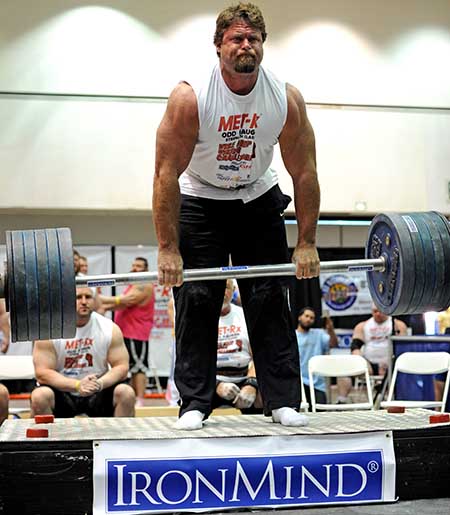 Mike Burke leads everyone on the Apollon’s Axle double overhand deadlift—a staple test in the grip strength world.  If you are chasing this lift yourself, you might like to hear that Mike struggled to pull this 516-lb. world record lift at the grip strength contest held at the 2013 Los Angeles FitExpo, but he didn't.  In fact, he followed this success by pulling 528 lb. to his knees, so eat your Wheaties if you're chasing Mike.  IronMind® | Randall J. Strossen photo.