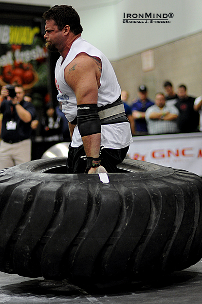 One of the unusual events Odd Haugen included this contest was a tire deadlift with nothing to grab but the tire itself.  Mike Burke blew through this like nothing on his way to the overall win at the LA FitExpo today.  IronMind® | Randall J. Strossen photo.