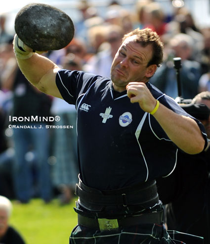 Aaron Neighbour, 2009 IHGF Highland Games World Champion, on the Braemar Stone (Edinburgh, Scotland).  IronMind® | Randall J. Strossen photo.