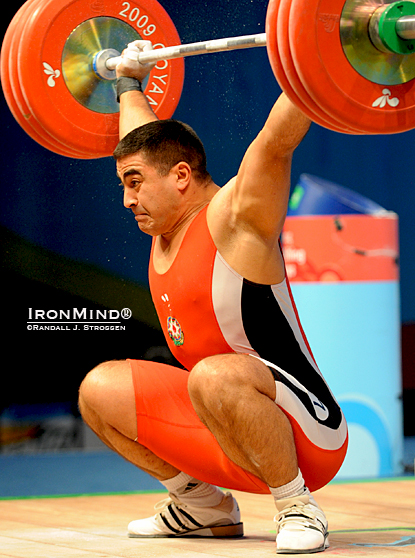 94-kg Nizami Pashaev (Azerbaijan) always good for some for some colorful moments and big lifts, nailed this 177-kg snatch at the 2009 World Weightlifting Championships, illustrating what would be the bottom position for an overhead squat.  Jim Schmitz says, “Because the overhead squat is such a great exercise for developing balance, flexibility, coordination, and strength, it has finally been ‘discovered’ by strength coaches, personal trainers, and CrossFitters—someday it really may be ‘America's favorite exercise!’  IronMind® | Randall J. Strossen photo.