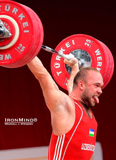 It’s his trademark: Ruslan Nurudinov celebrates his successful 190-kg gold medal snatch by sticking out his tongue.  IronMind® | Randall J. Strossen photo