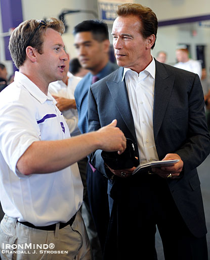 Coach Paul Doherty (left) highlights Sac High’s weightlifting program for California Governor Arnold Schwarzenegger.  IronMind® | Randall J. Strossen photo.