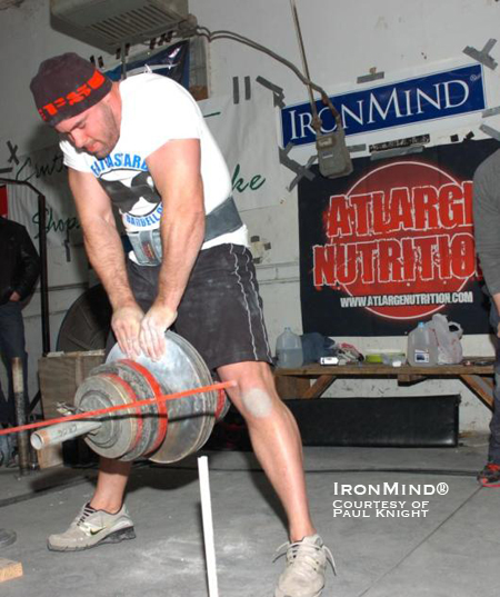 “This photo was taken during a grip contest at Metroflex gym in Arlington, Texas,” Paul Knight explained. “In this picture I was pinching 214.8 lb. on David Horne’s Euro pinch device which was the two hand pinching event in the contest along with grippers, bending, the IronMind Apollon’s Axle deadlift and a medley.  I placed 2nd to Jedd Johnson, a grip monster who is also certified on the CoC #3 and Ironmind Rednail.  This contest was sponsored by Ironmind.  Thanks  Randall for helping out w/the contest.”  IronMind® | Photo courtesy of Joe Musselwhite.