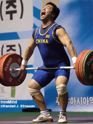 Peng Feng (China) is about to pop the 151-kg snatch that put him in the driver's seat at the Asian Junior Championships today in Gunsan, Korea. IronMind® | Randall J. Strossen, Ph.D. photo.
