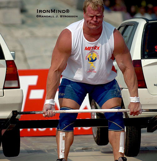 In 2006, Phil Pfister won the most coveted crown in strongman, World’s Strongest Man, ending an American drought that had lasted almost a quarter century.  Guys the size of Phil dwarf the cars they lift: Phil told IronMind that he’s currently weighing “a lean, mean 369.”  IronMind® | Randall J. Strossen photo.