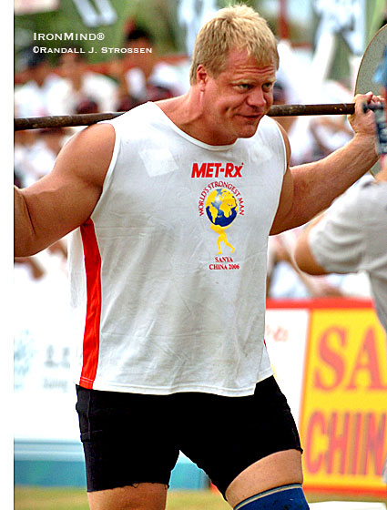 Taking a walk on the wild side, Phil Pfister warms up for the Car Walk at the 2006 World's Strongest Man. Destiny was calling and Pfister was reaching for the phone - a few hours later, he would be the first American since the mighty Bill Kazmaier to win the biggest competition in strongman, the World's Strongest Man contest. IronMind® | Randall J. Strossen photo. Taking a walk on the wild side, Phil Pfister warms up for the Car Walk at the 2006 World's Strongest Man. Destiny was calling and Pfister was reaching for the phone - a few hours later, he would be the first American since the mighty Bill Kazmaier to win the biggest competition in strongman, the World's Strongest Man contest. IronMind® | Randall J. Strossen photo.