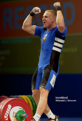 Andrei Rybakou (Belarus) celebrates his new world record in the snatch: 187 kg. Rybakou won all three gold medals in the 85-kg class at the World Weightlifting Championships tonight. IronMind® | Randall J. Strossen, Ph.D. photo. Andrei Rybakou (Belarus) celebrates his new world record in the snatch: 187 kg. Rybakou won all three gold medals in the 85-kg class at the World Weightlifting Championships tonight. IronMind® | Randall J. Strossen, Ph.D. photo.