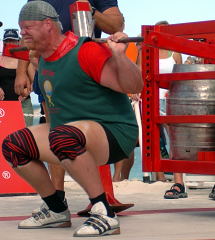 Magnus Samuelsson puts the spectacular Jamie Reeves-designed squat apparatus to the test at the 2004 World's Strongest Man contest (Paradise Island, Bahamas), which will be on TV soon - check your local listings for details. IronMind® | Randall J. Strossen, Ph.D. photo.