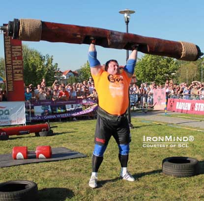 Zydrunas Savickas handles the 180-kg log in a shoulder power medley at SCL-Poland.  As mighty as Big Z is on pressing events, Misha Koklyaev won this medley.  IronMind® | Photo courtesy of SCL.