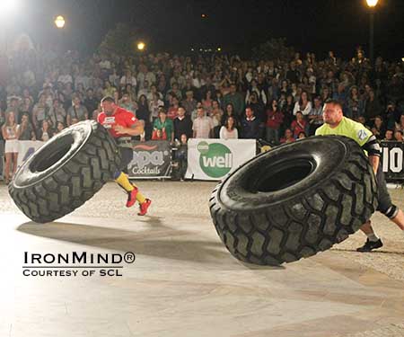 Terry Hollands (left) going head-to-head with Krzysztof Radzikowski (right) in the tire flip at SCL Portugal.  IronMind® | Photo courtesy of SCL