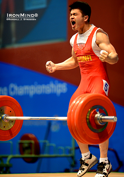 Shi Zhiyong (China) celebrates the go-ahead 180-kg clean and jerk that ended up giving him the gold medal for the jerk as well as for the total in the 69-kg class at the Asian Weightlifting Championships today.  IronMind® | Randall J. Strossen photo. 