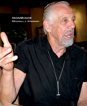Slim “The Hammerman,” a star performer at the annual AOBS dinner, explains a point in the fine art of steel bending.  IronMind® | Randall J. Strossen photo. 