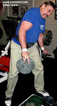 Richard Sorin, using a thumb and one finger, gives five 10-pound plates plenty of air time. IronMind® | Bert Sorin photo.