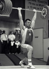 Nailing another one of his trademark clean and jerks, Szymon Kolecki hit this 232.5 kg world record (junior and senior) in the 94-kg category at the 2000 European Weightlifting Championships (Sofia, Bulgaria). IronMind® | Randall J. Strossen, Ph.D. photo. Nailing another one of his trademark clean and jerks, Szymon Kolecki hit this 232.5 kg world record (junior and senior) in the 94-kg category at the 2000 European Weightlifting Championships (Sofia, Bulgaria). IronMind® | Randall J. Strossen, Ph.D. photo.