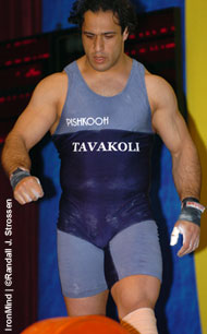 Looking good, Hossein Tavakoli approaches the bar at the 2004 Asian Weightlifting Championships (Almaty, Kazakhstan). Minutes later, Tavakoli blew a patella tendon in a devastating accident and has only recently resumed training on the lifts. IronMind® | Randall J. Strossen, Ph.D. photo.