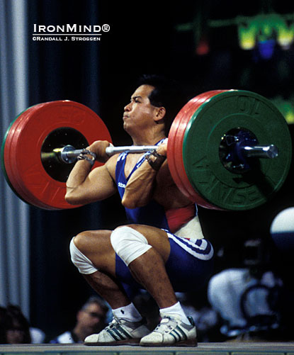 Just because Thanh Nguyen roller skated into The Sports Palace and ended up making an Olympic weightlifting team, don’t think he lived on Easy Street.  This shot is of Thanh cleaning 145 kg in the 64-kg class at the 1996 Olympics.  IronMind® | Randall J. Strossen photo.