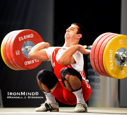 Chalk flying, the bar bending, Tigran Martirosyan hits the bottom with 205 kg.  Martirosyan cleaned the weight, but missed the jerk.  IronMind® | Randall J. Strossen photo.
