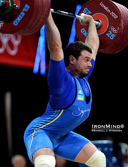 The door was opened for Oleksiy Torokhtiy (Ukraine) in the 105s and he walked in and seized the gold medal, clinching the deal with this third attempt 227-kg power jerk.  IronMind® | ©Randall J. Strossen photo.