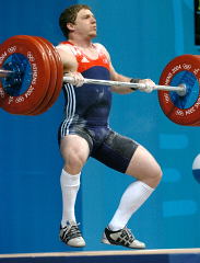 Chad Vaughn pulls himself under his 175-kg opening clean and jerk at the 2004 Olympics. IronMind® | Randall J. Strossen, Ph.D. photo.