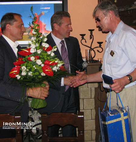 Vladimir Kiba (right) turned 60 last week and the famed pole vaulter and president of the Ukrainian Olympic Committee Sergey Bubka (center) was among the guests enjoying themselves and honoring Kiba.  On the left is Oleksandr Yakovlev (former triple jumper), another fried of the Kibas and the head of finance for the Ukrainian Olympic Committee. IronMind® | Photo courtesy of Olena Kiba.  