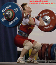 Wang Mingjuan on her way up with 118 kg, a lift that gave her the junior and senior world records in both the jerk and the total. IronMind® | Randall J. Strossen, Ph.D. photo.