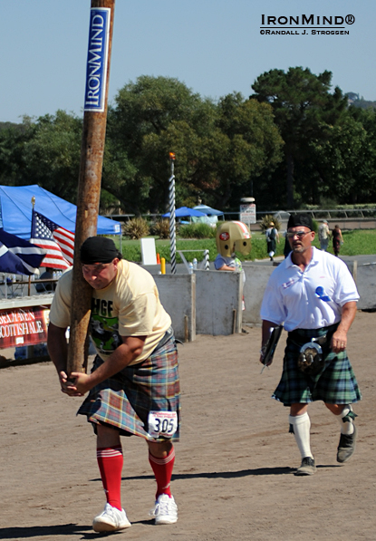 Francis Brebner was a world class Highland Games athlete and since retiring from competition he has turned to administration, coaching and refereeing—all aimed at advancing the Highland Games.  Here, Brebner (right) keeps a sharp eye on Sebastian Wenta (left), who is about to launch the caber at the 2011 edition of the Caledonian Club of San Francisco’s top tier Highland Games in Pleasanton, California.  IronMind® | Randall J. Strossen photo.