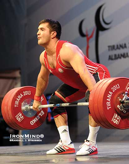 With this 180-kg snatch, Intigam Zairov (Azerbaijan) pocketed the first of his three gold medals in the 94-kg category at the 2013 European Weightlifting Championships in Tirana, Albania.  IronMind® | Randall J. Strossen photo
