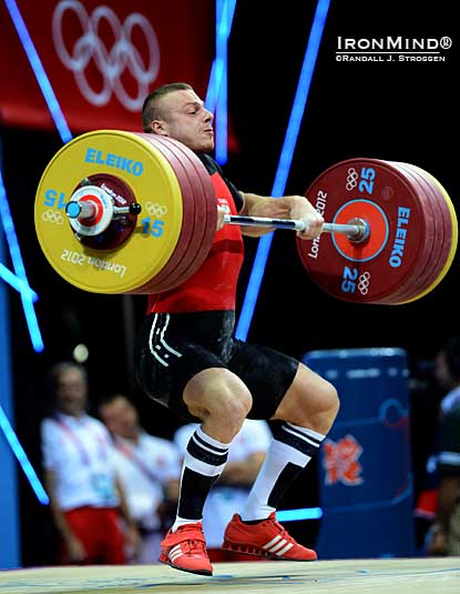 Adrian Zielinski (Poland) pulls himself under 211 kg in what proved to be the winning clean and jerk in the men’s 85-kg class at the Olympics tonight.  IronMind® | Randall J. Strossen photo.