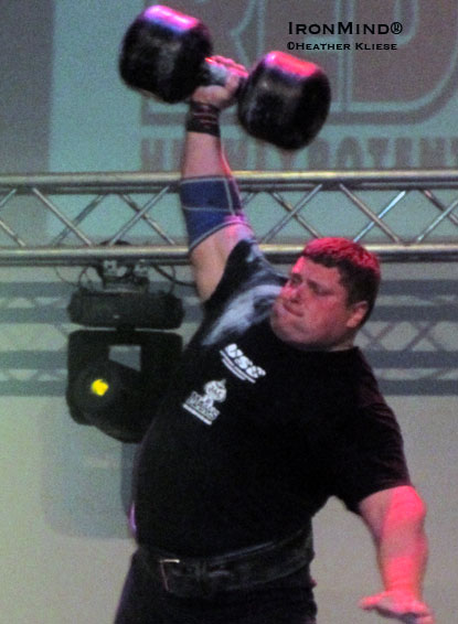 Zydrunas Savickas bangs out 11 reps to win the dumbbell press at the Ultimate Strongman Championships.  IronMind® | Photo courtesy of Heather Kliese.