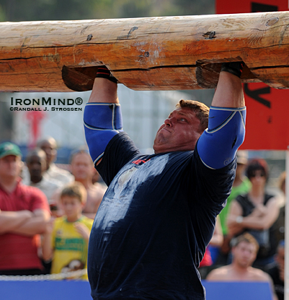 Proving once again that he is the king of the overhead lifts in strongman, Zydrunas Savickas broke the world record in the log with this 210-kg lift today at the 2010 MET-Rx World’s Strongest Man contest.  IronMind® | Randall J. Strossen photo.
