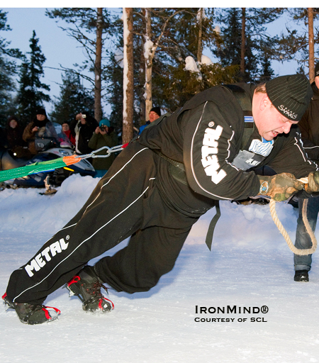 Strongman competitors routinely use rock climbing shoes for added traction on the truck pull, so when there’s snow and ice underfoot, they switch over to crampons.  IronMind® | Courtesy of Strongman Champions League.