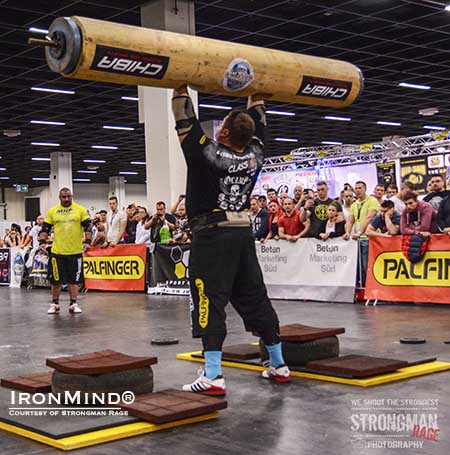 The Log Lift King, Zydrunas Savickas, doing his thing at the FIBO.  IronMind® | Photo courtesy of Strongman Rage
