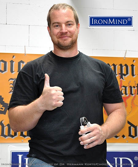 Carl-August Mertz has just been certified on the Captains of Crush No. 3 gripper—his credits range from feats of raw strength to balance, and he has already been certified on the IronMind Red Nail, too. IronMind® | Photo courtesy of Dr. Hermann Korte/Choice of Champions