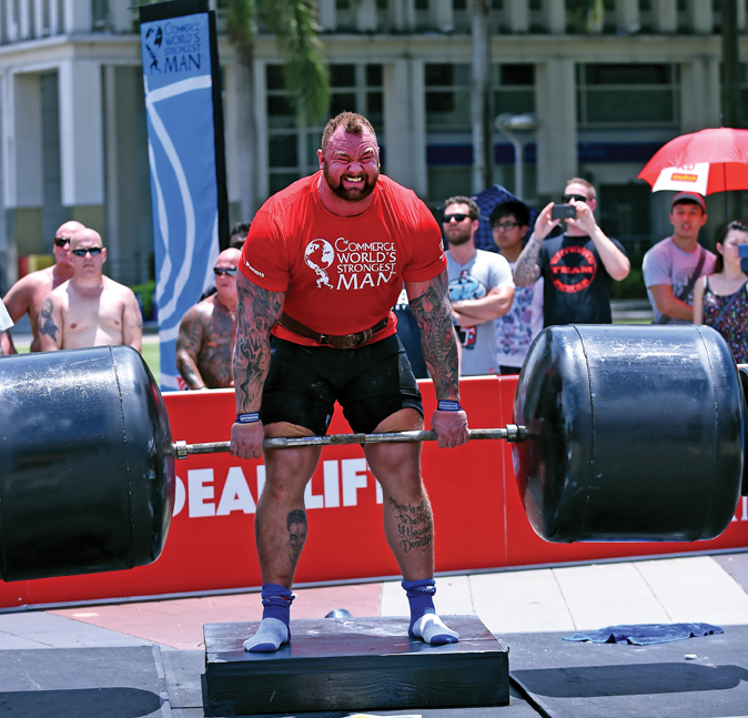 Hafthor Julius Bjornsson, using Strong-Enough Lifting Straps, grinds out reps on the deadlift at the 2015 World’s Strongest Man competition in Putrajaya, Malaysia. Randall J. Strossen photo.