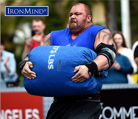 Hafthor Julius Bjornsson in flight with an IronMind Tough-As-Nails sandbag at World's Srongest Man 2014. Randall Strossen photo.