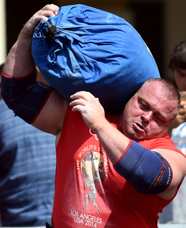 Dimitar Savatinov shoulders the Tough-As-Nails Sandbag at World's Strongest Man 2014. Randall Strossen photo.