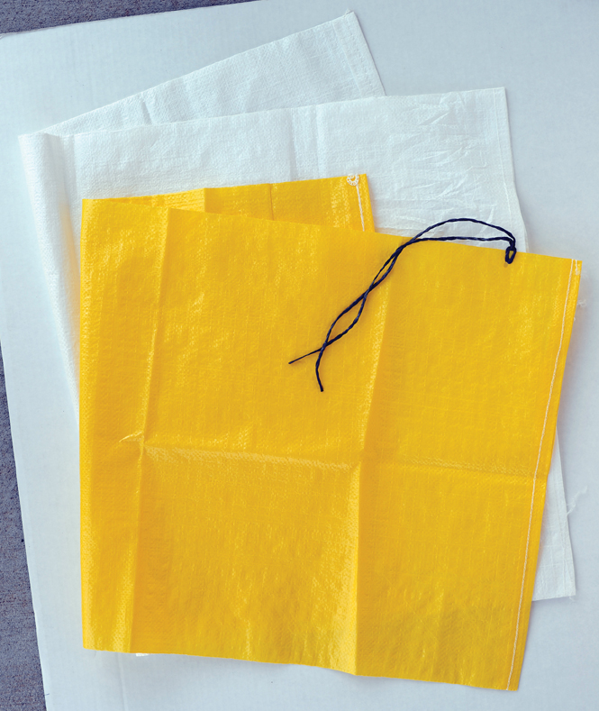 Use the liners with Tough-As-Nails Sandbags as full size or partially filled to make a bunch of sandbag "weights": fill, fold, and secure with duct tape; coarser-grained sand works best.