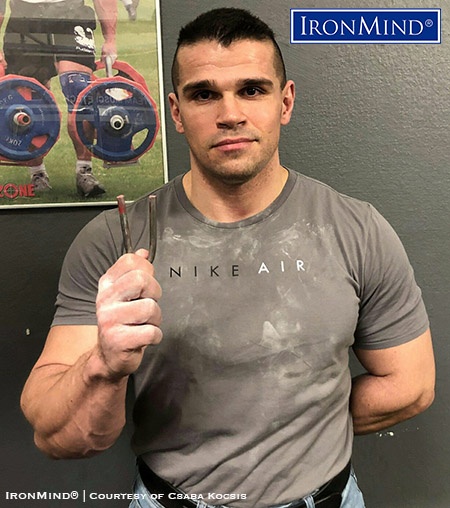 Looking for new challenges, longtime bodybuilder Csaba Kocsis started grip training and steel bending—proving his success, Csaba has just been certified on the IronMind Red Nail, a benchmark steel bend. IronMind® | Photo courtesy of Csaba Kocsis