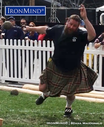 Top-ranked pro Spencer Tyler rang in the debut of the professional class at the Queen Mary Highland Games with two world records, one on the 28-lb. weight for distance (shown), and one on the 20-lb. sheaf toss. IronMind® | ©Dana MacDonald photo