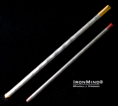 The IronMind Gold Nail is like the Red Nail after doing SUPER SQUATS  . . . bigger, stronger, tougher.  The Red Nail is 7” x 5/16” and the Gold Nail is 8-3/8” x 3/8”.  IronMind® | Randall J. Strossen photo.