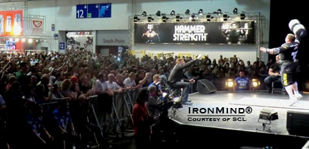 The Big Z (Zydrunas Savickas) on stage before a packed house at the FIBO Power, where the SCL Germany contest took place.  "The Strongman Champions League is getting an incrediblly strong value at the FIBO," said Marcel Mostert.  IronMind® | Photo courtesy of SCL.
