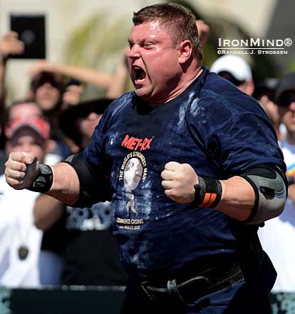 Usually reserved, Zydrunas Savickas celebrates his 220-kg world record in the log lift set today at the World’s Strongest Man contest.  IronMind® | Randall J. Strossen photo.
