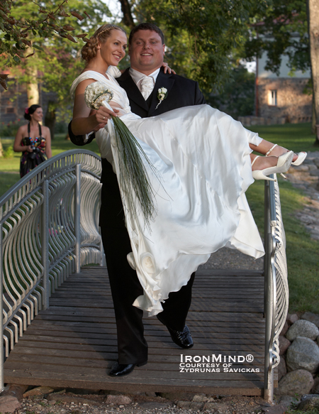 Cross training or is this just another time when it makes life easy to be a World’s Strongest Man winner?  Zydrunas Savickas makes light work of carrying his bride, Jurgita, over a bridge.  IronMind® | Photo courtesy of Zydrunas Savickas.