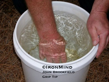 Drive your hand into the water (above) and then open it explosively for improved grip strength and hand health.  ©IronMind/John Brookfield Grip Tip.