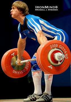 Dmitri Lapikov (Russia) smoked this 191-kg snatch in the 105s at the 2009 World Weightlifting Championships.  Using straps wisely in training helps increase your top lifts in competition.  IronMind® | Randall J. Strossen photo.